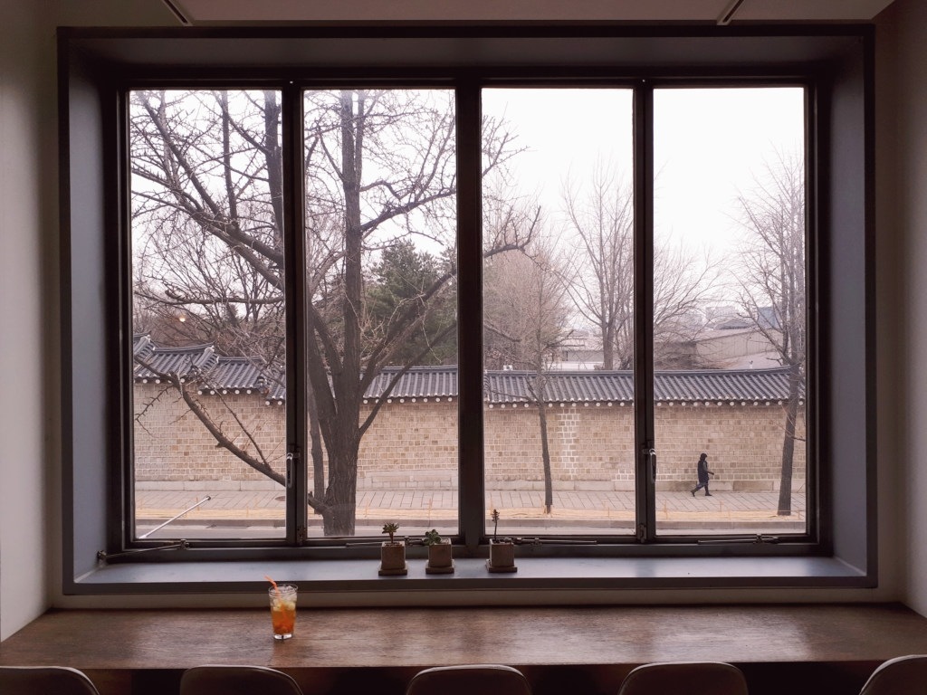 Window overlooking the street on an autumn day