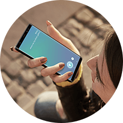 A Thumbnail image with woman commanding to mobile via Bixby.