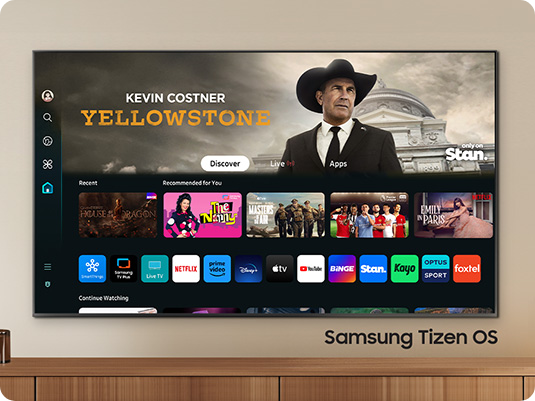 The 2024 Samsung OLED TV displays various free channels and streaming content on the Samsung Tizen OS home screen.