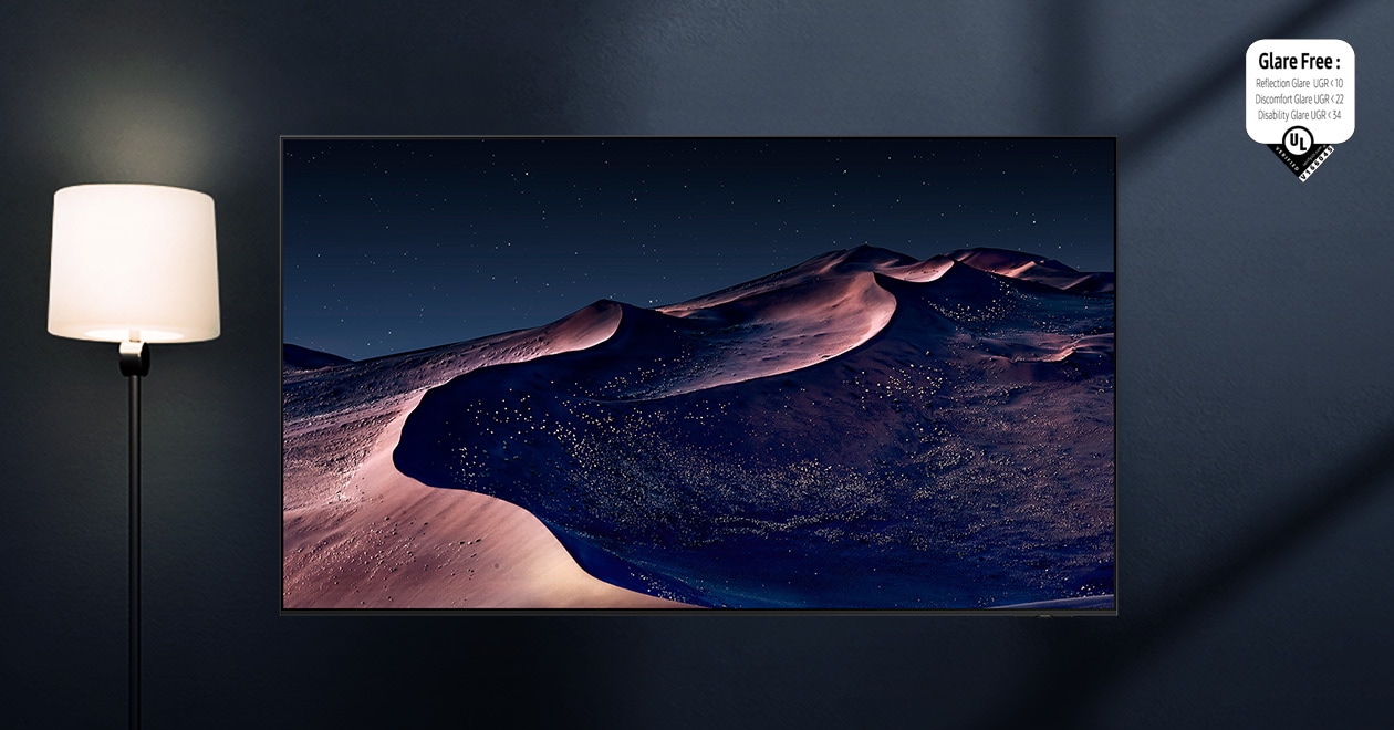 A TV displays a scene of a desert in a starry night. A nearby lamp throws distracting reflections on the screen. With glare-free technology, the screen becomes clear. UL Verified Logo. Glare Free: Reflection Glare UGR < 10, Discomfort Glare < UGR 22, Disability Glare < 34. verifyUL.com®. V166045.