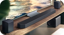 Q990H speaker on wooden shelf