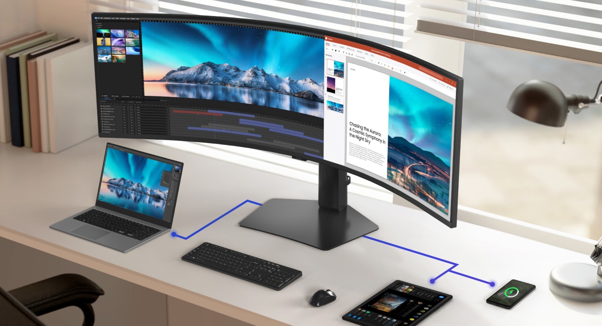 A Samsung ViewFinity curved monitor surrounded by a laptop, tablet, and phone on a desk. The monitor display has a split-screen with a photo editing interface on the left and a presentation on the right. Multiple connectivity options, including USB-C, Thunderbolt, HDMI, and DisplayPort are showcased to connect to nearby devices.