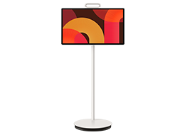 A Samsung The Movingstyle 27LSM7F TV displays abstract shapes in red and yellow tones on screen.