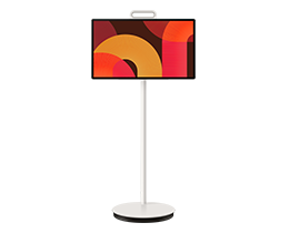 A Samsung The Movingstyle 27LSM7F TV displays abstract shapes in red and yellow tones on screen.