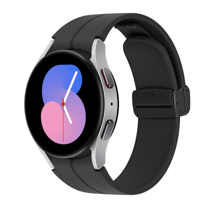 A silver Galaxy Watch5 with a black D-Buckle sport band is shown at a tilted angle.