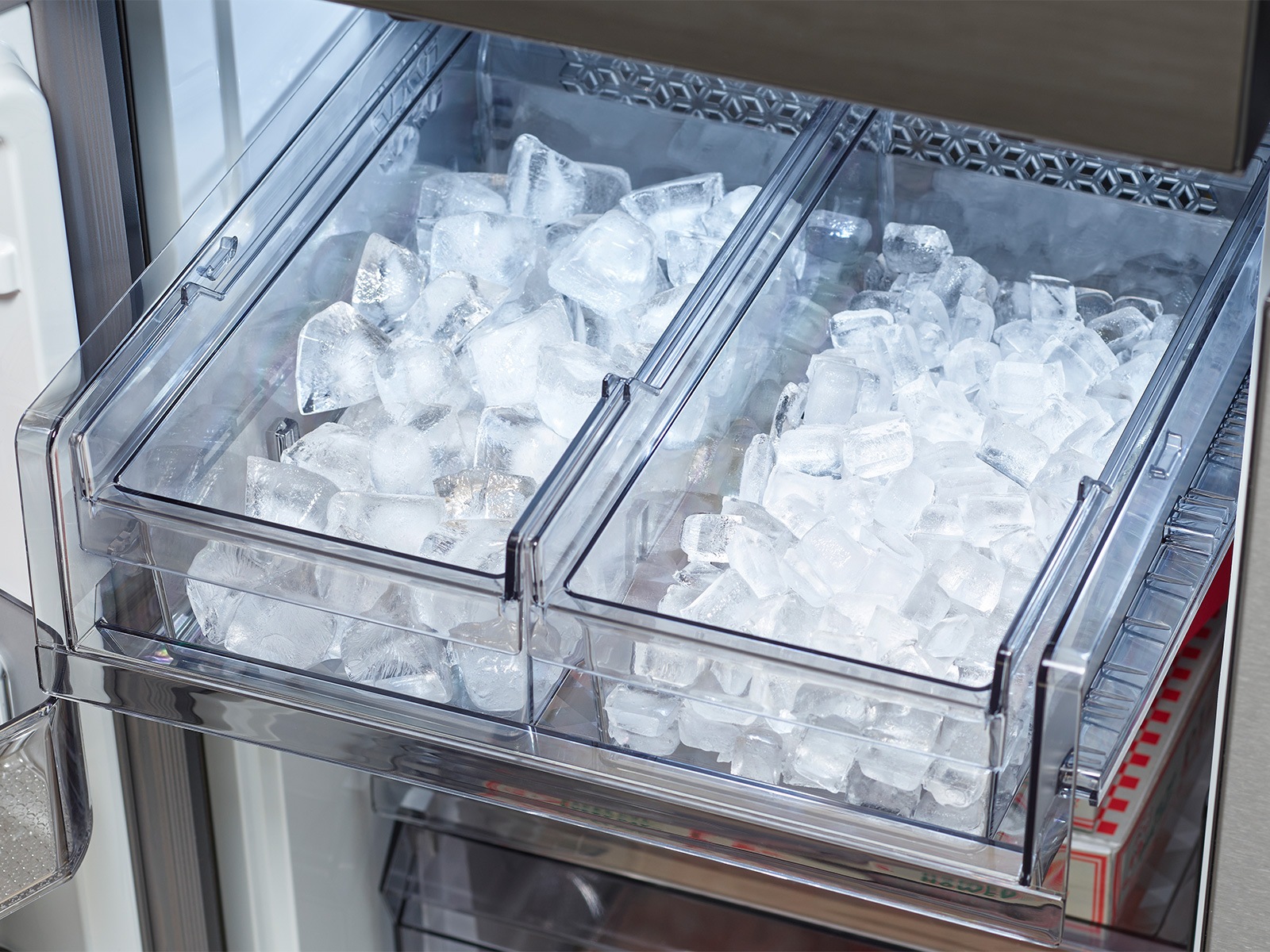 Inside Samsung Bespoke refrigerator with open dual ice maker trays